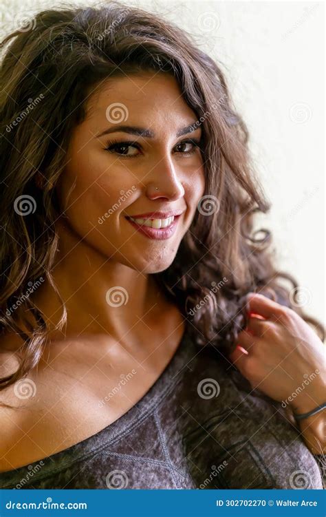 Lustrous Elegance Captivating Poses Of A Beautiful Brunette Lingerie Model For The Lens Stock