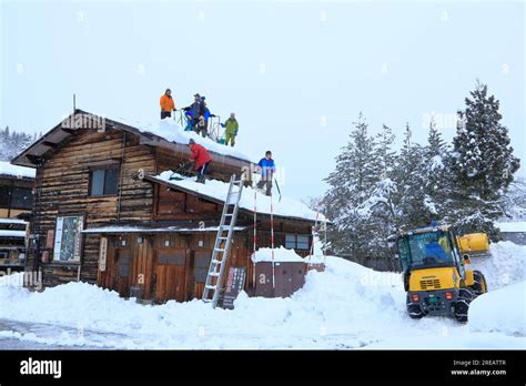 Clearing snow from Shirakawa-go Stock Photo - Alamy