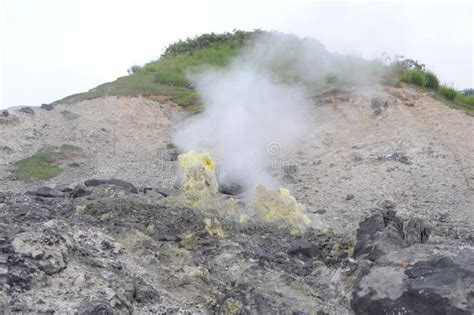 Acidic Hot Spring Stream Water With Hydrochloric Acid Emitting Steam In Mountain Valley At