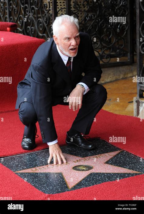 Actor Malcolm Mcdowell Touches His Star After He Was Honored With The 2