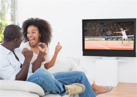 I ______ Watching Tennis On Tv. - Premium Photo | Couple cheering while watching tennis match on television
