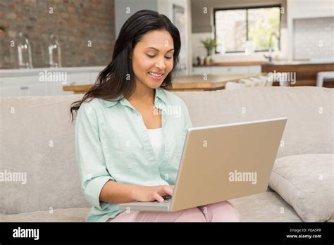 Smiling Brunette Using Laptop Stock Photo Alamy
