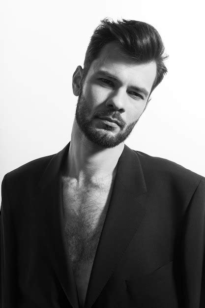 Premium Photo Bearded Man Posing In Black Suit With Naked Torso