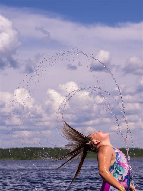 The Girl Frolics In The Water On A Hot Sunny Summer Day And Is Happy Stock Image Image Of