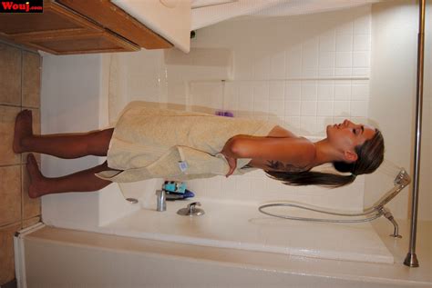 Desirable Brunette Girl Posing In Black Lingerie On The Couch Photos