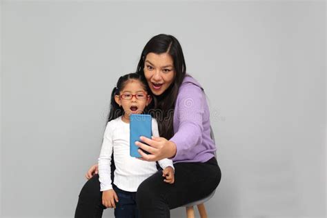 Single Divorced Latina Mom And Daughter Use Cell Phone To Video Call Take Selfies Play Video