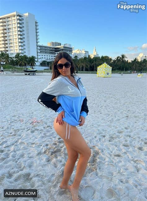 Claudia Romani Sexy Photos Showing Off Her Hot Legs At The Beach AZNude