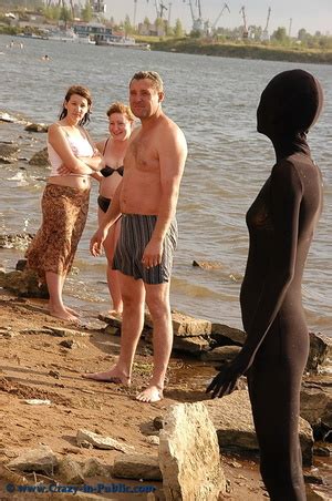 Two Hot Black And Baige Zentai Wearing Teen Enjoying The XXX Dessert