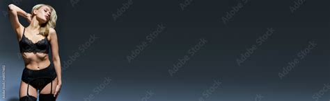 Sexy Woman In Black Lingerie And Stockings Posing With Arm Behind Head With Closed Eyes Banner