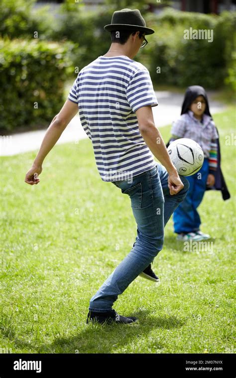 Enjoying A Quick Game Soccer Young Guy Playing Football Outdoors