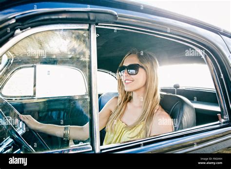 Caucasian Woman Driving Vintage Car Stock Photo Alamy