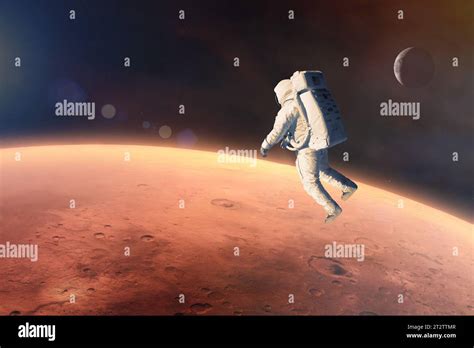 Cosmonaut Floating In Outer Space Close To Mars Planet Elements Of