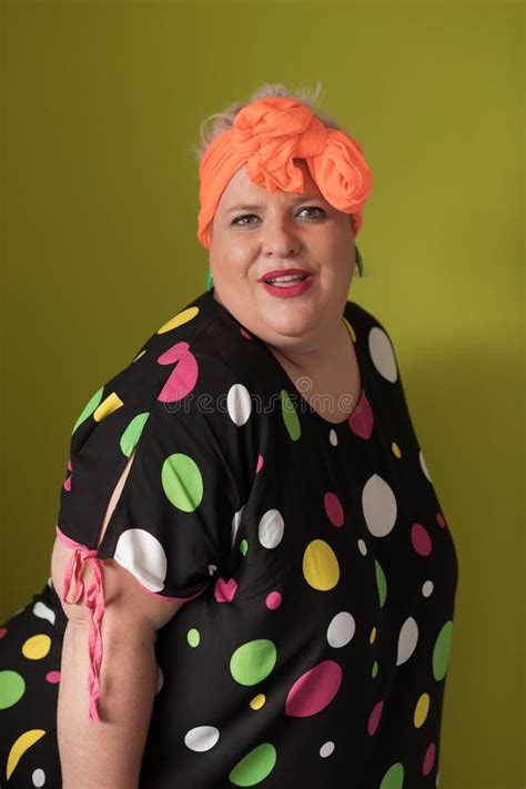 Plus Size Model Woman With Trendy Makeup Fashionable Blonde In Black Short Dress Posing At The