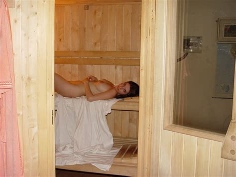 Naked Amateur Vivian Inserts A Sex Toy While Relaxing In A Sauna NakedPics