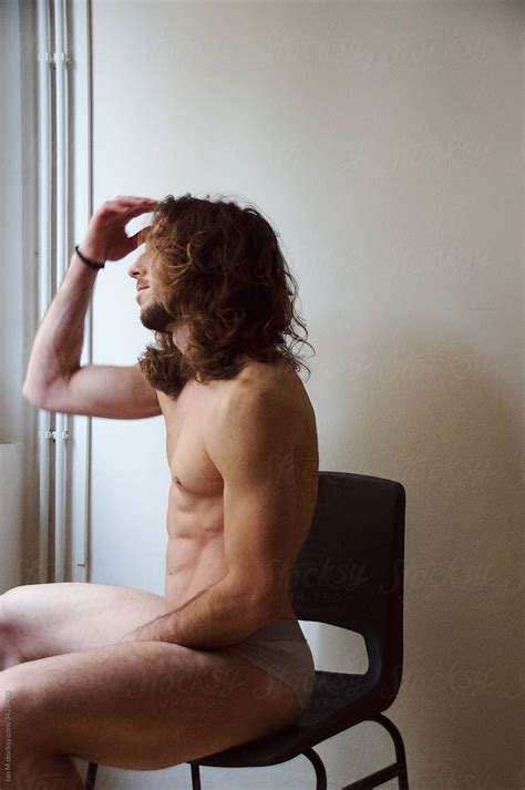 Nude Long Hair Masculine Male Model In Front Of White Wall By Stocksy Contributor Ian M