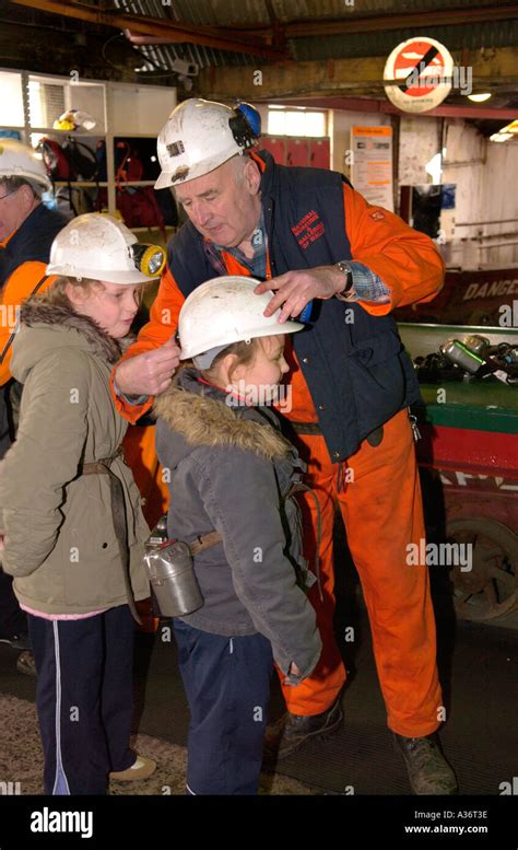 Guides Who Are Former Miners Fit Visitors With Lamps And Hard Hats At