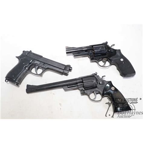 Three replica guns including S&W .44 MAG, S&W .44 MAG long and a model 92