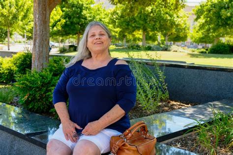 Mature Woman Smiling In The Park Stock Photo Image Of White Park 254108418