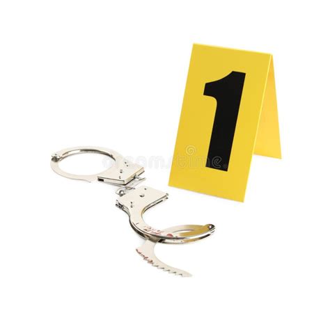 Handcuffs And Crime Scene Marker With Number One Isolated On White