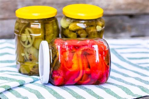 Premium Photo Glass Jars With Pickled Red Bell Peppers And Pickled