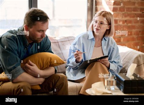 Mature Therapist Giving An Advice To Her Patient During Their Session