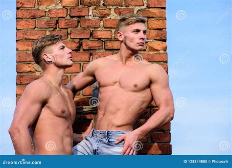Men Muscular Chest Naked Torso Stand Brick Wall Background Strong Muscles Emphasize Masculinity