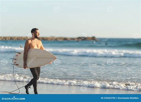 A Smiling Man Surfer With Naked Torso Walking On The Seashore Stock Image Image Of Surfer