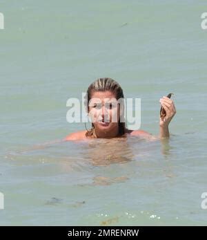 Reality Show Actress Josie Goldberg Wears A Red And White Striped Bikini As She Enjoys The Waves