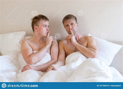 Handsome Gay Men Couple On Bed Together Love And Relationships Stock