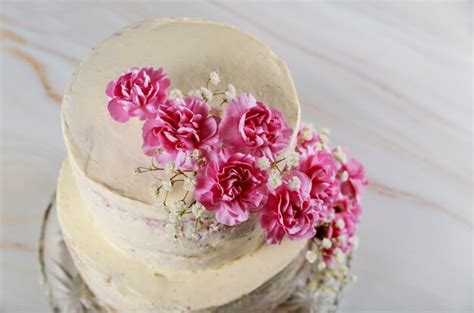 Premium Photo Wedding Naked Cake Decorated With Pink Flowers