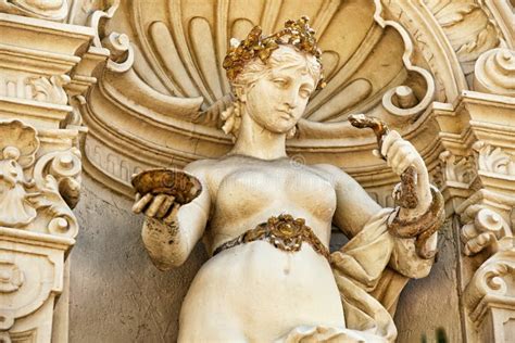 Statue Of Naked Lay Holding Snake And Saucer Stock Image Image Of