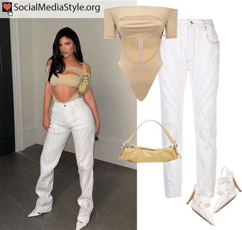 Kylie Jenner S Cutout Nude Bodysuit White Pants Yellow Bag And White Heels