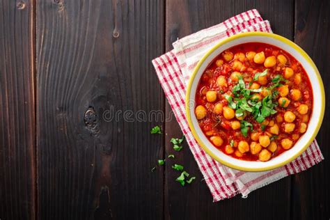 Spicy Chickpea Curry Chana Masala In Bowl On Wooden Table Stock Photo