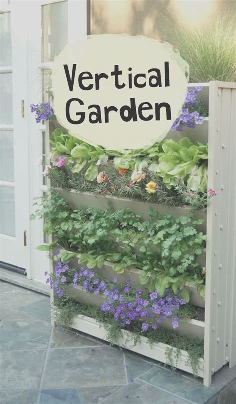 Vertical Garden With Purple Flowers And Green Plants