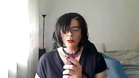 Horny MILF Tranny Simulates Giving A Footjob While Playing With A Vibrator With Her Red Painted