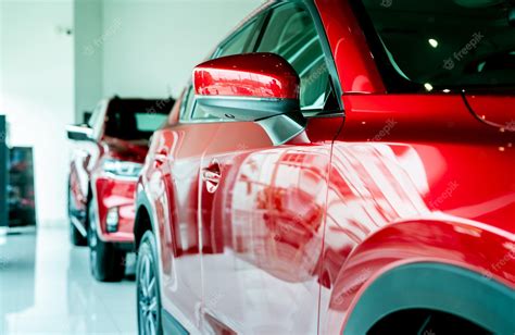 Premium Photo Selective Focus Red Car Parked In Luxury Showroom Car