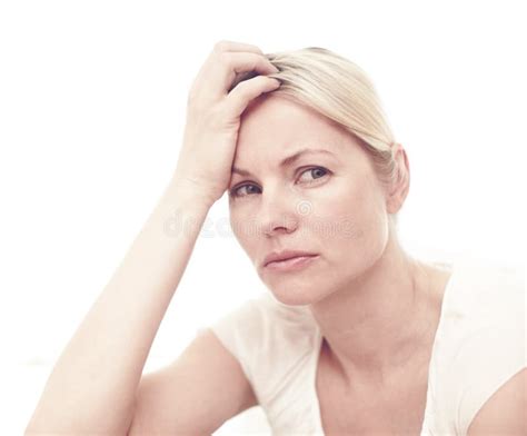 Her Problems Seem Overwhelming A Concerned Looking Blonde Woman Looking Away While Sitting By