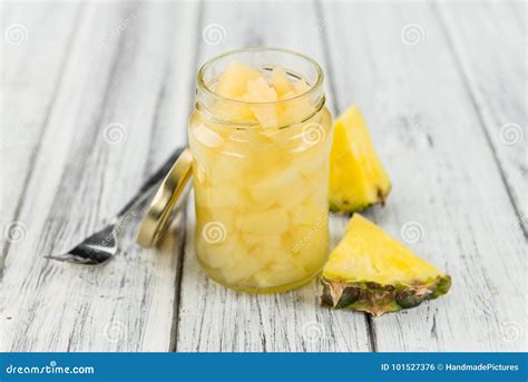 Portion Of Chopped Pineapple Preserved On Wooden Background S Stock