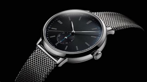 A Black And Silver Watch With A Black Face And A Silver Band Premium