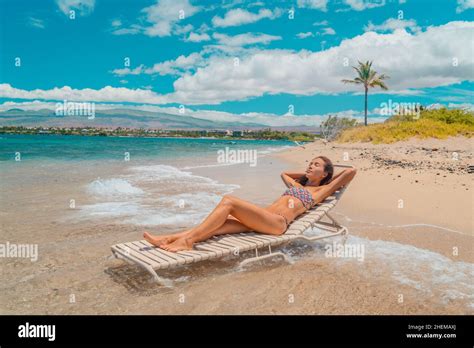 Beach Vacation Woman Relaxing In Bikini Lying Down On Sun Lounger