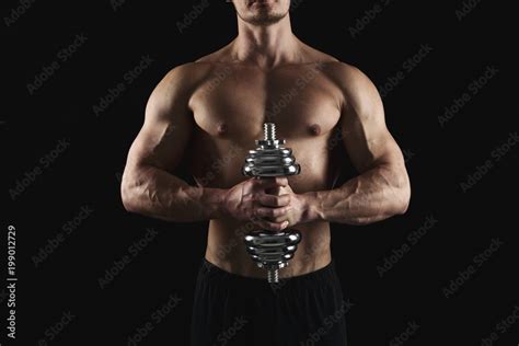 Strong Athletic Man With Dumbbell Showes Naked Muscular Body Stock Photo Adobe Stock