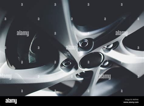Modern automotive wheel on light alloy disc Stock Photo - Alamy
