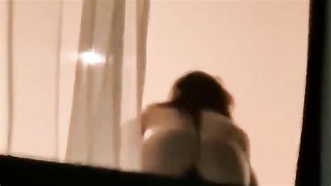 Ass Out In Public As Naked Girl Shows Off Her Pussy Through Hotel Room Window In New York