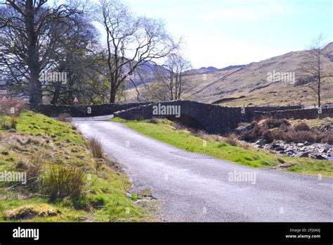 Road And Bridge Over The River Duddon Harter Fell In Background At