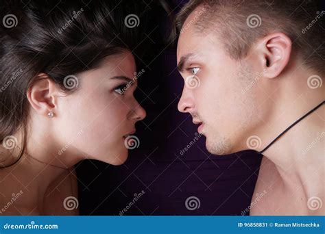 Girl And Boy Looking At Each Other In Bed Naked Lovers On The Violet Sheet Stock Image Image