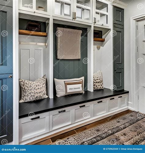 A Farmhouse Style Mudroom With A Built In Bench Cubbies And