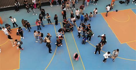 Models And Photographers At Public Basketball Courts During An Event
