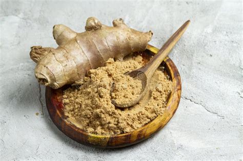 Ginger Root And Powder In Wooden Container Stock Image Image Of