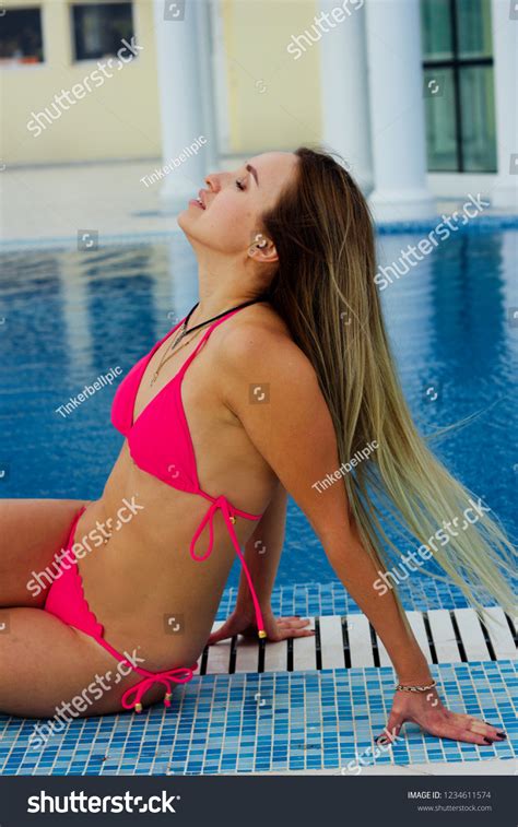 Sexy Blondehaired Woman Pink Bikini Sitting Stock Photo 1234611574 Shutterstock