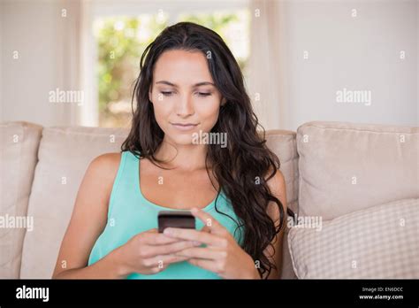 Pretty Brunette Texting With Her Smartphone Stock Photo Alamy